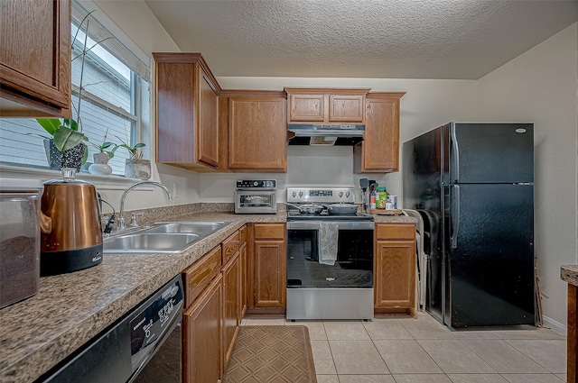 kitchen with sink, a textured ceiling, light tile patterned floors, black refrigerator, and stainless steel electric stove