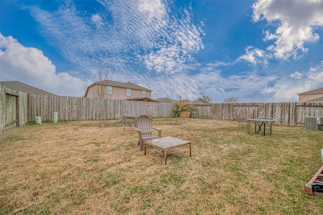 view of yard with central AC