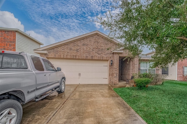 view of front of home with a garage and a front lawn