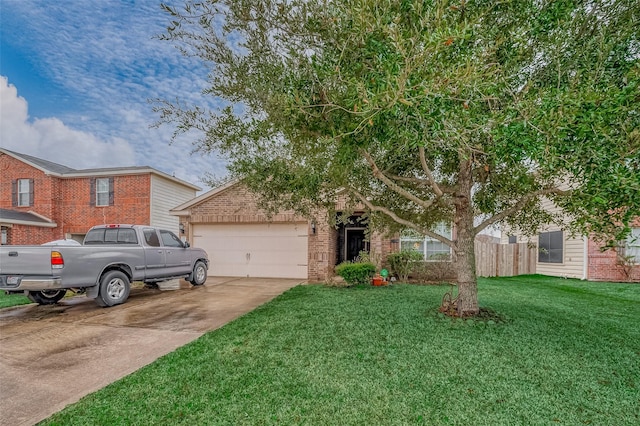 view of property hidden behind natural elements with a garage and a front lawn