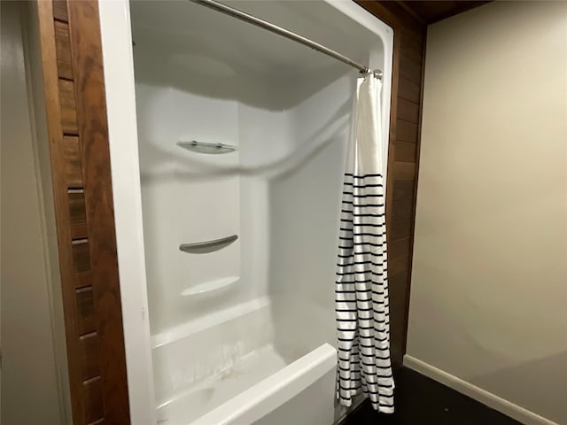 bathroom with shower / bathtub combination with curtain