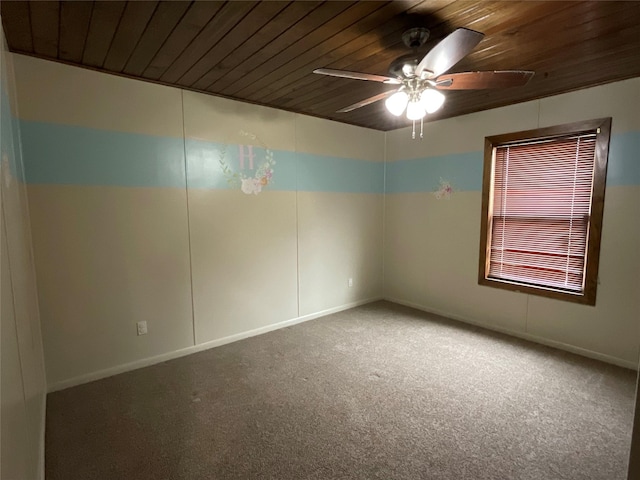 empty room with wooden ceiling, ceiling fan, and carpet flooring