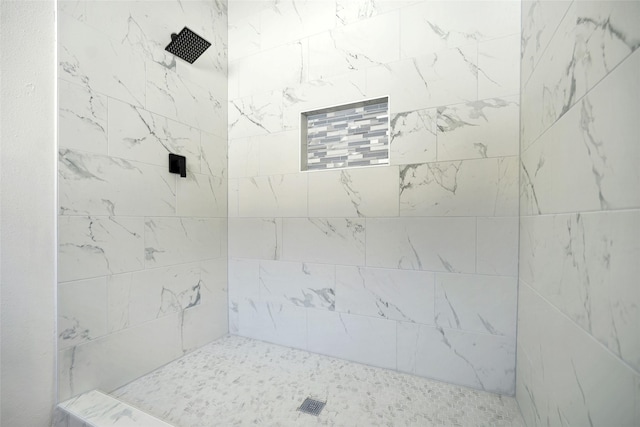 bathroom featuring tiled shower