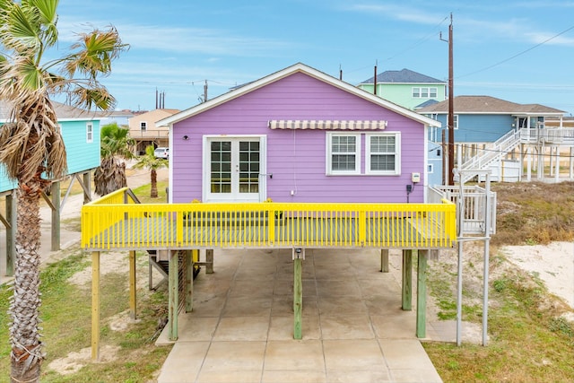 exterior space featuring a carport and a deck