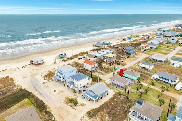 bird's eye view with a beach view and a water view