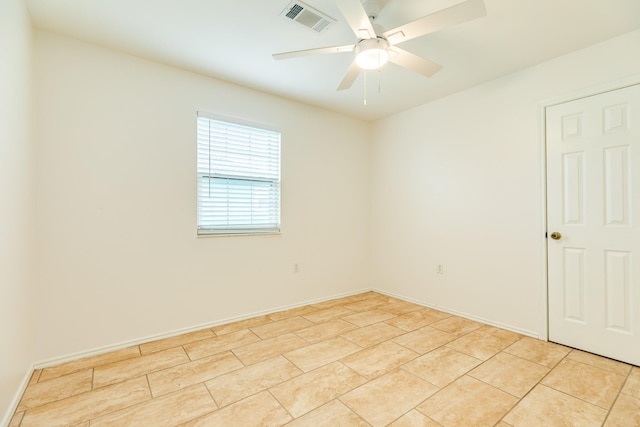 tiled empty room with ceiling fan