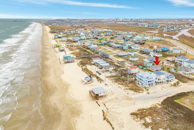 aerial view with a view of the beach and a water view