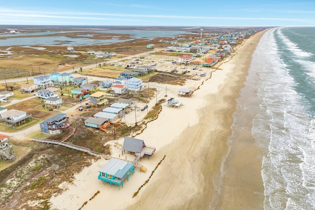 drone / aerial view with a view of the beach and a water view