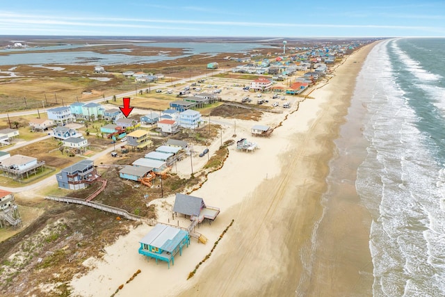 bird's eye view with a view of the beach and a water view