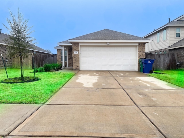 view of front facade featuring a garage and a front yard