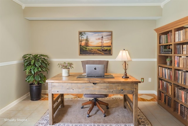 office area with ornamental molding and tile patterned flooring