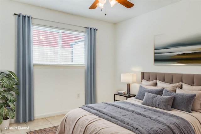 tiled bedroom with ceiling fan