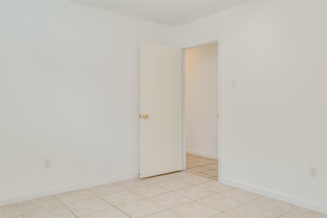 empty room featuring light tile patterned flooring