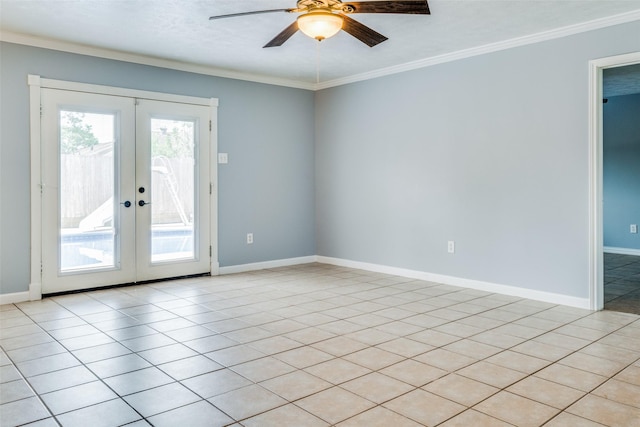 tiled empty room featuring ornamental molding, french doors, and ceiling fan