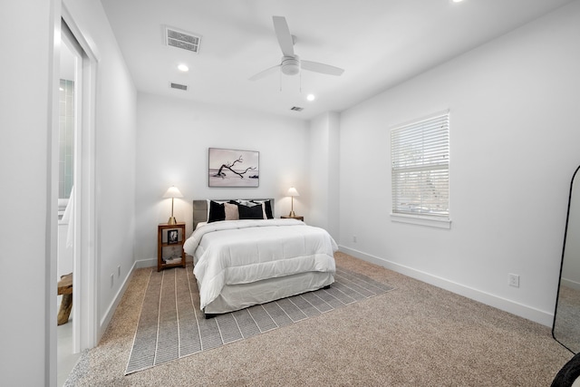 bedroom featuring ceiling fan and carpet