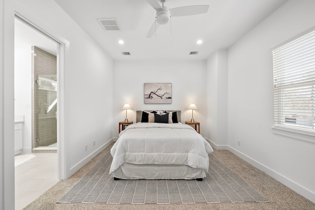 carpeted bedroom featuring connected bathroom and ceiling fan