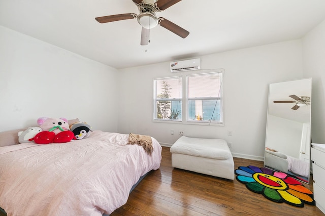 bedroom featuring ceiling fan, dark hardwood / wood-style flooring, and an AC wall unit