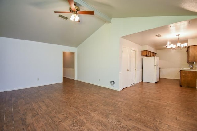 unfurnished living room with lofted ceiling with beams, wood-type flooring, sink, and ceiling fan with notable chandelier