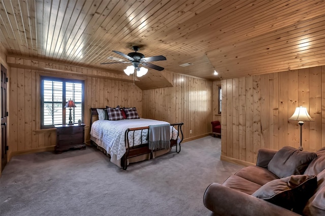 bedroom with carpet flooring, wooden ceiling, and wood walls