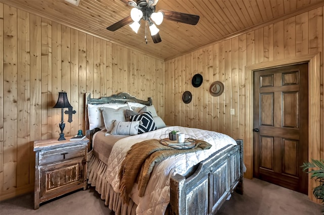 bedroom featuring wood ceiling, ceiling fan, and dark colored carpet