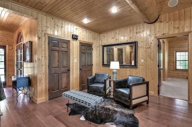 sitting room with wood ceiling, hardwood / wood-style floors, and wood walls