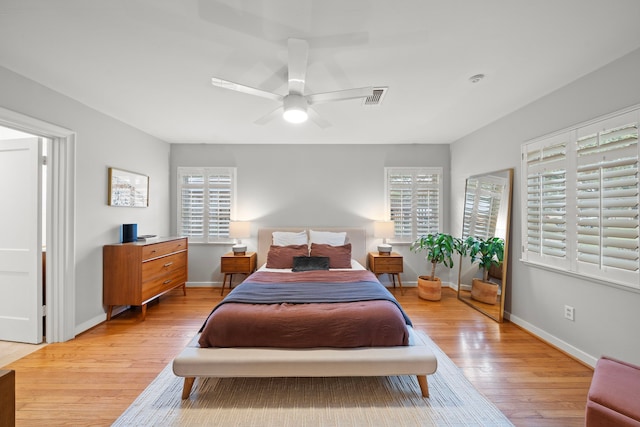 bedroom featuring ceiling fan and light hardwood / wood-style flooring