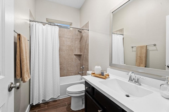 full bathroom with shower / tub combo with curtain, vanity, and toilet