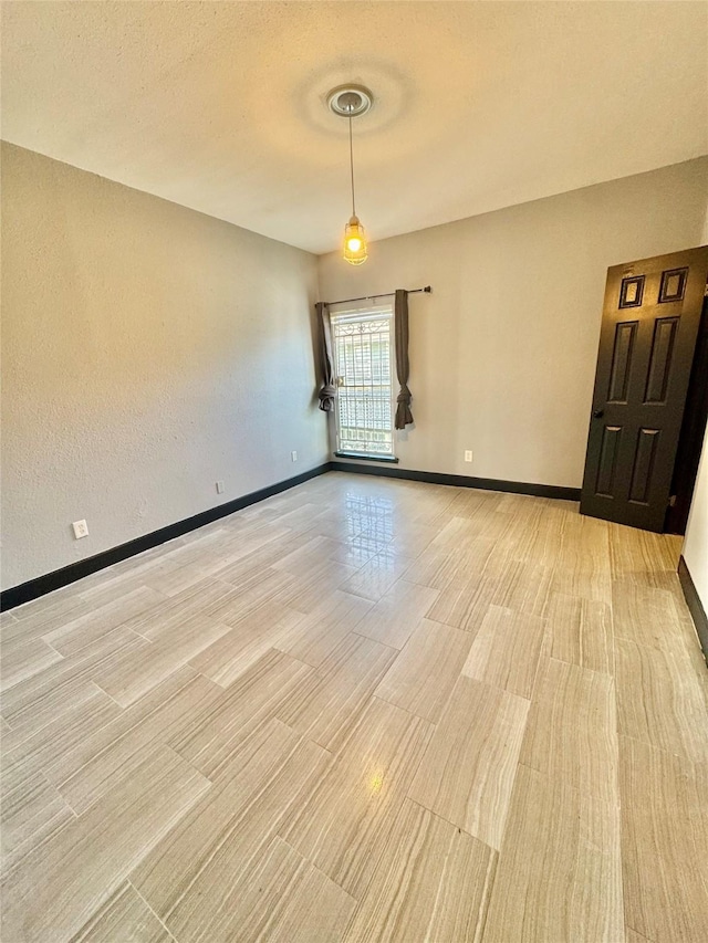 empty room featuring a textured ceiling