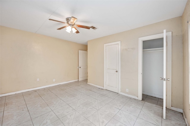 unfurnished bedroom featuring ceiling fan