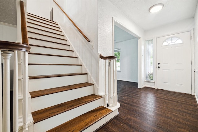 foyer entrance with dark hardwood / wood-style flooring