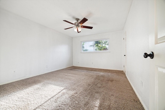 unfurnished room featuring ceiling fan and carpet flooring