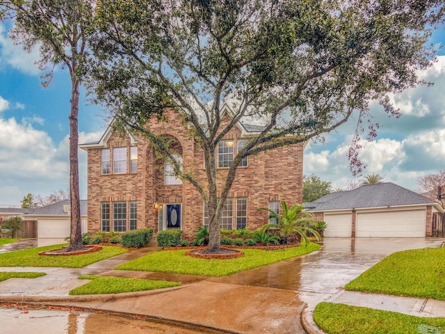 view of front facade with a garage and a front lawn