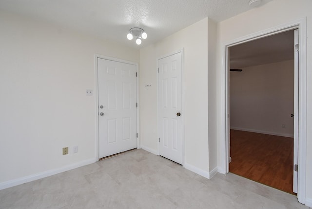 entryway with a textured ceiling