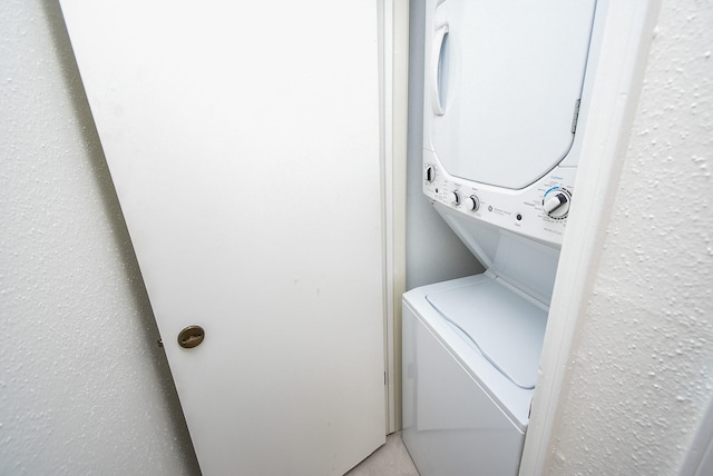 washroom with stacked washer / dryer