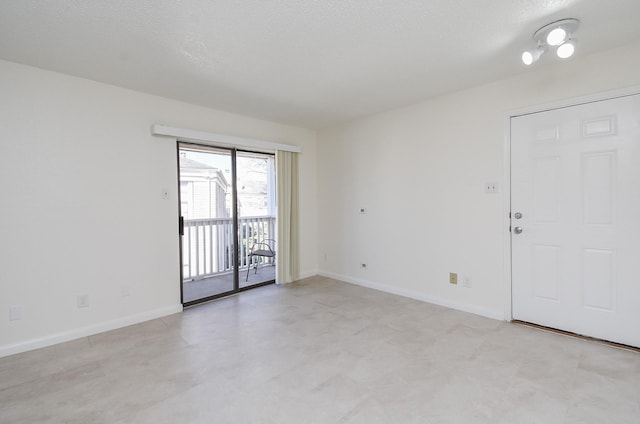 spare room featuring a textured ceiling