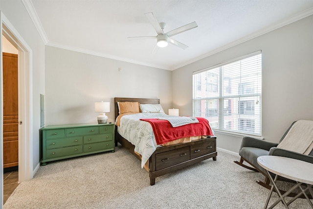 bedroom featuring light colored carpet, ornamental molding, and ceiling fan