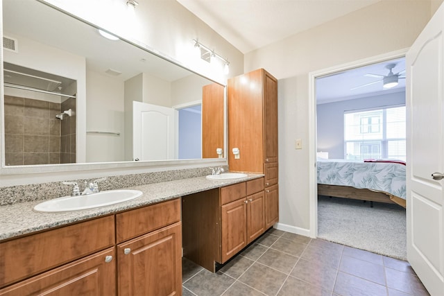 bathroom featuring vanity, tile patterned floors, ceiling fan, and walk in shower