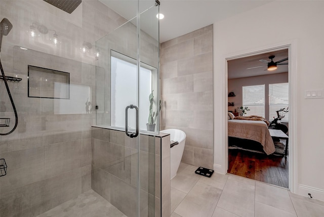 bathroom featuring tile patterned flooring, tile walls, and walk in shower