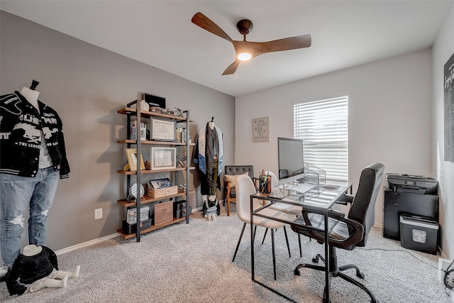 office featuring ceiling fan and light carpet