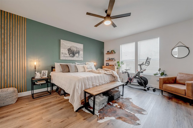 bedroom featuring ceiling fan and light hardwood / wood-style floors