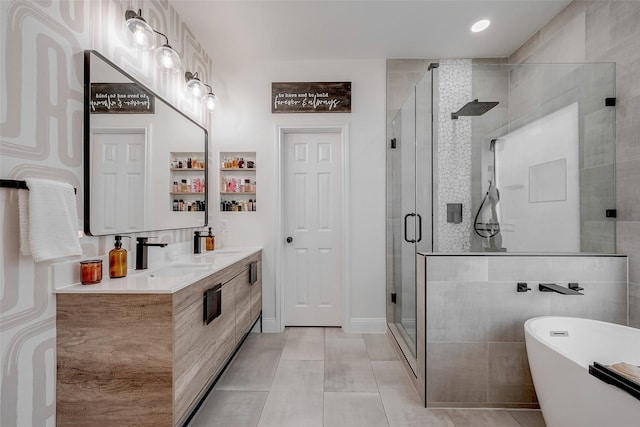 bathroom with tile patterned floors, plus walk in shower, and vanity