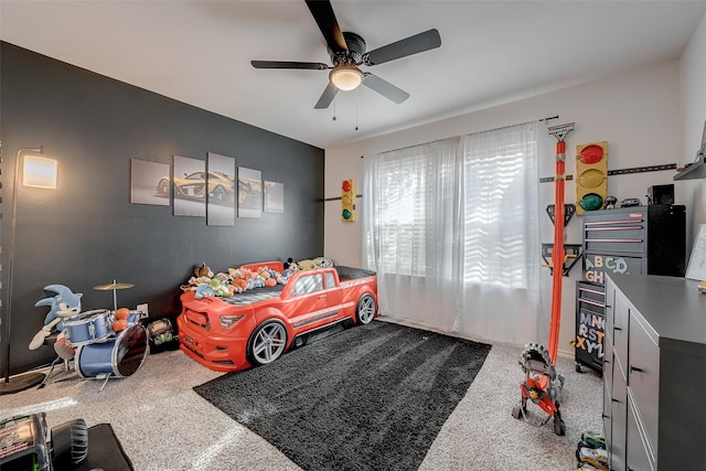 bedroom with ceiling fan and carpet floors