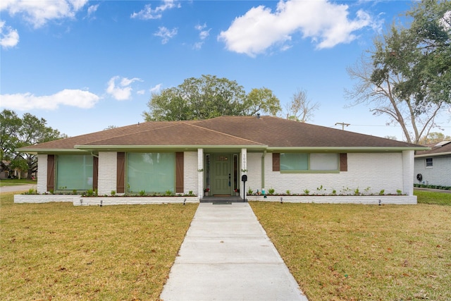 ranch-style home featuring a front yard