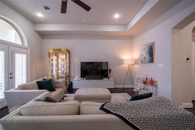 living room featuring french doors and ceiling fan