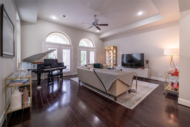 living room featuring french doors, ceiling fan, and dark wood-type flooring