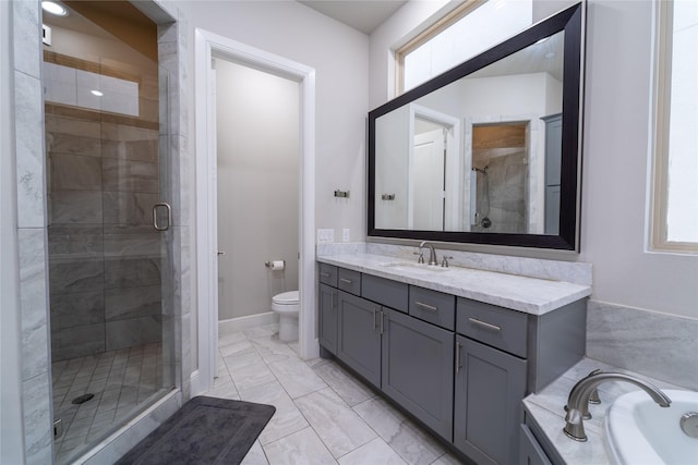 full bathroom featuring toilet, vanity, and shower with separate bathtub