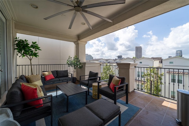 view of patio featuring a balcony, outdoor lounge area, and ceiling fan