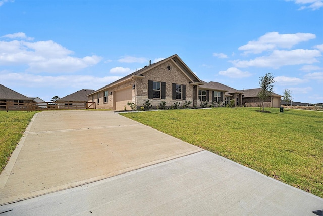 single story home with a garage and a front lawn