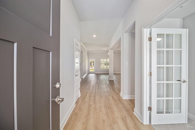 hall with recessed lighting, baseboards, and light wood-style floors