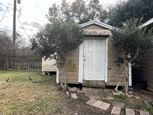 view of outdoor structure with a lawn